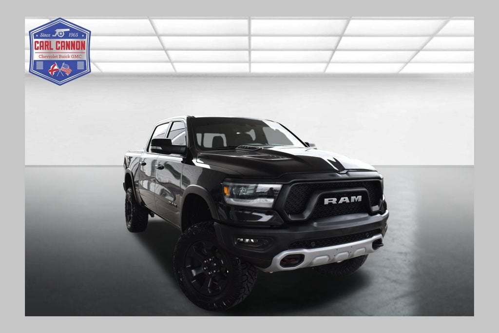 2022 RAM 1500 Rebel in Diamond Black Crystal Pearlcoat — front three-quarter view