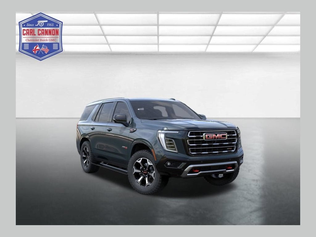 2026 GMC Yukon AT4 in Midnight Pine — front three-quarter view