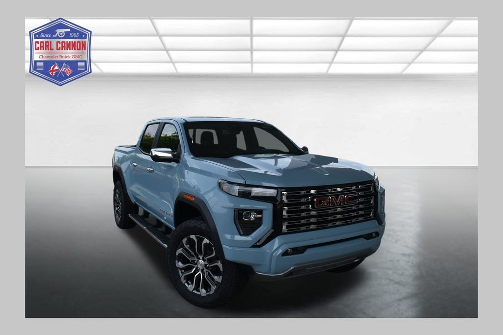 2026 GMC Canyon Denali in Glacier Metallic — front three-quarter view