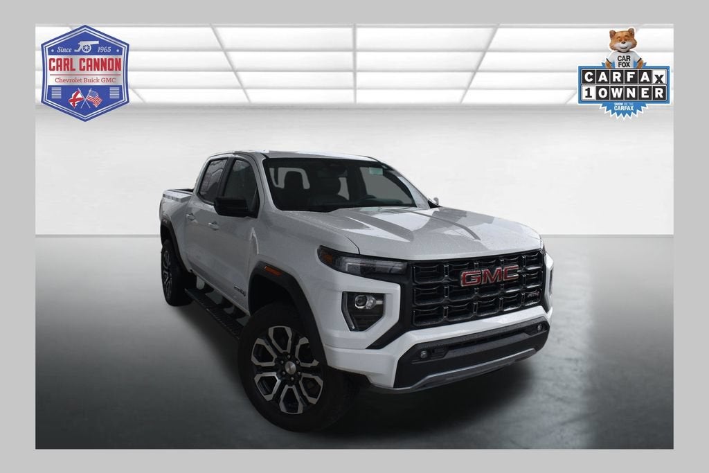 2024 GMC Canyon AT4 in Summit White — front three-quarter view