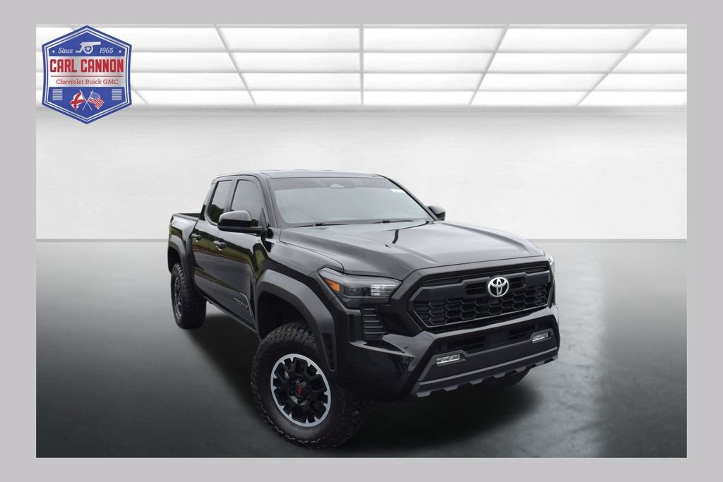 2024 Toyota Tacoma 4WD SR5 in Black — front three-quarter view