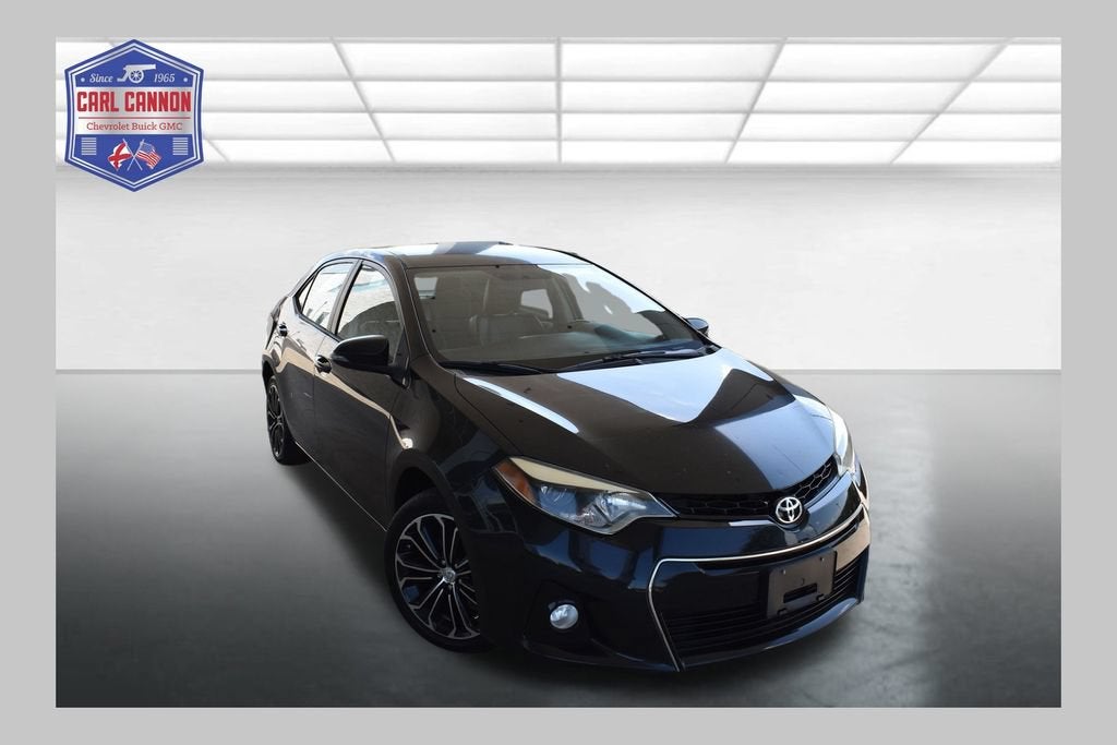 2016 Toyota Corolla L in Black Sand Pearl — front three-quarter view